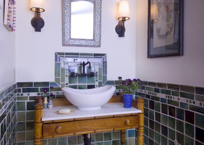 Thomas Buckborough Bathroom Sink Vignette with Sconse on